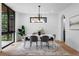 Bright dining room with a modern chandelier, large windows, and stylish decor at 357 S Franklin St, Denver, CO 80209