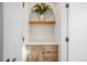 Hallway with an arched alcove and a wooden cabinet and floating shelf, adding character at 357 S Franklin St, Denver, CO 80209