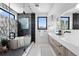 A luxurious bathroom with a soaking tub, rainfall shower, and double sink vanity at 357 S Franklin St, Denver, CO 80209