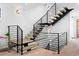 Modern staircase with wood treads, metal railings, and stylish lighting at 357 S Franklin St, Denver, CO 80209