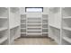 A spacious walk-in closet with custom shelving units and ample storage space at 357 S Franklin St, Denver, CO 80209