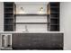 Stylish wet bar includes dark cabinets, a stainless steel refrigerator, and bright shelving at 357 S Franklin St, Denver, CO 80209