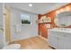 Stylish bathroom featuring modern fixtures, decorative tile, and ample natural light at 6498 S Everett Way, Littleton, CO 80123