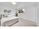 Bright bedroom featuring neutral tones, a plush bed, and a view to the backyard at 6498 S Everett Way, Littleton, CO 80123