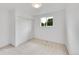 Bright bedroom features neutral carpet and a window adding lots of natural light at 6498 S Everett Way, Littleton, CO 80123