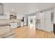 Modern kitchen featuring white cabinets, stainless steel appliances, and granite countertops at 6498 S Everett Way, Littleton, CO 80123