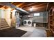 Unfinished basement offers laundry, utility area, and potential for customization at 4360 S Braun Ct, Morrison, CO 80465