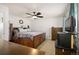 Spacious bedroom featuring a ceiling fan, and a bedframe with built-in storage drawers at 4360 S Braun Ct, Morrison, CO 80465