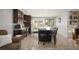 Spacious kitchen with a large central island, modern appliances, and convenient sliding glass doors at 4360 S Braun Ct, Morrison, CO 80465