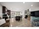 Open concept view of the kitchen with a central island that flows into the Gathering room and staircase at 4360 S Braun Ct, Morrison, CO 80465