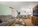 Cozy living room with comfortable seating and a view of the staircase at 4360 S Braun Ct, Morrison, CO 80465