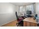 Dedicated home office features a large window with natural light and a comfortable desk setup at 4360 S Braun Ct, Morrison, CO 80465