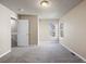 Bright bedroom boasts neutral walls, new carpet, and natural light through sizable windows at 8690 Allison St # H, Arvada, CO 80005