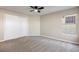 Bright bedroom featuring neutral walls, plush carpet, and a window with a view at 8690 Allison St # H, Arvada, CO 80005