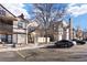 View of townhomes with private patios, assigned parking, and appealing architectural details at 8690 Allison St # H, Arvada, CO 80005