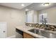 Granite countertop kitchen with stainless steel sink and dishwasher at 8690 Allison St # H, Arvada, CO 80005