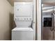 Stackable washer and dryer in convenient laundry closet at 8690 Allison St # H, Arvada, CO 80005