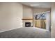 Living room with fireplace and sliding glass doors at 8690 Allison St # H, Arvada, CO 80005