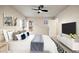 Comfortable main bedroom with decor, a ceiling fan, and a window providing natural light at 8690 Allison St # H, Arvada, CO 80005