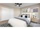 Cozy bedroom with neutral decor, a comfortable bed, and ample closet space at 8690 Allison St # H, Arvada, CO 80005