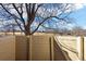 Private patio area with wooden enclosure and backyard view at 8690 Allison St # H, Arvada, CO 80005
