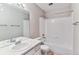 Bathroom features a white vanity, toilet, and a shower/tub combo at 2575 S Syracuse Way # 101, Denver, CO 80231
