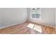 Bedroom features hardwood floors and a window at 2575 S Syracuse Way # 101, Denver, CO 80231