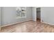 Comfortable bedroom boasts hardwood floors, a window and closet at 2575 S Syracuse Way # 101, Denver, CO 80231
