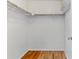 Walk-in closet with rod and shelf and wood floors at 2575 S Syracuse Way # 101, Denver, CO 80231