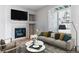 Relaxing living room showcases a fireplace, comfortable sofa, and stylish decor for cozy evenings at 2575 S Syracuse Way # 101, Denver, CO 80231