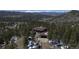 Beautiful exterior shot featuring a home with a dome structure surrounded by lush green trees and mountains at 29657 Loomis Way, Golden, CO 80403
