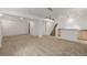 Finished basement with carpet, wet bar, and stairway to the main floor at 12319 W Burgundy Ave, Littleton, CO 80127