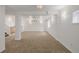 Finished basement featuring neutral carpet, recessed lighting, wet bar, and stairway at 12319 W Burgundy Ave, Littleton, CO 80127