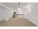Finished basement with carpet, wet bar, and stairway to the main floor at 12319 W Burgundy Ave, Littleton, CO 80127