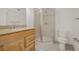 Bathroom featuring modern vanity, sink, and a glass-enclosed shower at 12319 W Burgundy Ave, Littleton, CO 80127