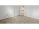 Empty room featuring neutral carpet and a double closet, ideal for maximizing storage at 12319 W Burgundy Ave, Littleton, CO 80127