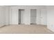 Bedroom with carpeted floors and double closets that offer ample storage, perfect for organization at 12319 W Burgundy Ave, Littleton, CO 80127