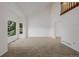 Spacious living room with plush carpet flooring, vaulted ceiling, large windows and white walls at 12319 W Burgundy Ave, Littleton, CO 80127