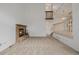 Bright and airy living room with brick fireplace, carpet, and high ceilings at 12319 W Burgundy Ave, Littleton, CO 80127
