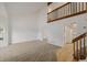 Spacious living room with plush carpet flooring, vaulted ceiling, large windows and white walls at 12319 W Burgundy Ave, Littleton, CO 80127