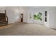 Spacious living room with plush carpet flooring and large windows offering plenty of natural light at 12319 W Burgundy Ave, Littleton, CO 80127