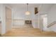 Bright living space with hardwood floors, and view of the fireplace below at 12319 W Burgundy Ave, Littleton, CO 80127