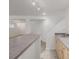 Finished basement wet bar with cabinets, countertops, and adjacent stairway at 12319 W Burgundy Ave, Littleton, CO 80127