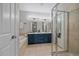 Elegant bathroom with double sinks, soaking tub, and walk-in shower with glass doors at 10523 Ashfield St # 5C, Highlands Ranch, CO 80126
