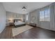 Spacious primary bedroom featuring a ceiling fan, wood floors, and large windows at 10523 Ashfield St # 5C, Highlands Ranch, CO 80126