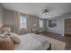 Beautiful primary bedroom with plush carpet, large windows, and comfortable furnishings at 10523 Ashfield St # 5C, Highlands Ranch, CO 80126