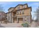 Attractive multi-level townhome boasts stone accents, attached garages and well manicured landscaping at 10523 Ashfield St # 5C, Highlands Ranch, CO 80126