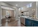 Open-concept living room with high ceilings, fireplace, and modern decor at 10523 Ashfield St # 5C, Highlands Ranch, CO 80126