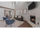 Cozy living room with fireplace, high ceilings and comfortable seating at 10523 Ashfield St # 5C, Highlands Ranch, CO 80126