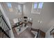 Bright, open living room with high ceilings, fireplace, and ample natural light at 10523 Ashfield St # 5C, Highlands Ranch, CO 80126